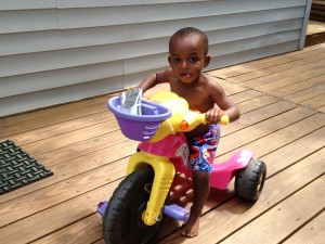 Travis Riding a Dora Bike